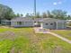 Charming single-story home with a walkway and a well-maintained lawn at 425 Fireball Ct, Punta Gorda, FL 33950