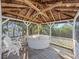 Hot tub in screened gazebo with wood ceiling at 425 Fireball Ct, Punta Gorda, FL 33950