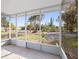 Screened-in patio with tile flooring offering views of the lush yard at 425 Fireball Ct, Punta Gorda, FL 33950