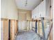 Room with exposed framing, wall studs and plumbing ready for renovation at 425 Fireball Ct, Punta Gorda, FL 33950