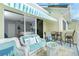 Balcony with seating area and view into bedroom at 4410 Warren Ave # 504, Port Charlotte, FL 33953