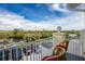 Balcony with view of waterway, parking and lush landscape at 4410 Warren Ave # 504, Port Charlotte, FL 33953