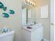 Clean bathroom with white vanity and a large mirror at 4410 Warren Ave # 504, Port Charlotte, FL 33953