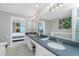 Double vanity bathroom with soaking tub and bedroom view at 4410 Warren Ave # 504, Port Charlotte, FL 33953