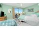 Bedroom with light green walls, a double bed, and access to a balcony at 4410 Warren Ave # 504, Port Charlotte, FL 33953