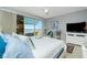 Main bedroom with water view, king-size bed, and private balcony access at 4410 Warren Ave # 504, Port Charlotte, FL 33953