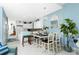 Kitchen and dining area with breakfast bar and seating at 4410 Warren Ave # 504, Port Charlotte, FL 33953