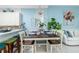 Bright dining area with table and chairs, adjacent to kitchen at 4410 Warren Ave # 504, Port Charlotte, FL 33953