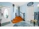 Entryway with hardwood stairs, light blue walls, and wood floors at 4410 Warren Ave # 504, Port Charlotte, FL 33953