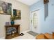 Bright entryway with hardwood floors and white interior doors at 4410 Warren Ave # 504, Port Charlotte, FL 33953