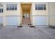 Townhouse entry with stairs leading to double doors and garages at 4410 Warren Ave # 504, Port Charlotte, FL 33953