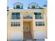 Front view of two-story townhouse with double garages and balconies at 4410 Warren Ave # 504, Port Charlotte, FL 33953