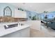 White kitchen with island, granite countertops and water views at 4410 Warren Ave # 504, Port Charlotte, FL 33953