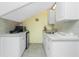 Small galley kitchen with white cabinets and a mini fridge at 4410 Warren Ave # 504, Port Charlotte, FL 33953