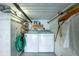 Basement laundry area with washer, dryer, and storage at 4410 Warren Ave # 504, Port Charlotte, FL 33953