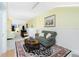 Living room with a comfy sofa and access to the bedroom at 4410 Warren Ave # 504, Port Charlotte, FL 33953