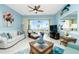 Spacious living room featuring water views and comfortable furnishings at 4410 Warren Ave # 504, Port Charlotte, FL 33953