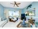 Living room with water views, ceiling fan, and comfortable seating area at 4410 Warren Ave # 504, Port Charlotte, FL 33953