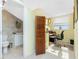Home office with built-in desk and adjacent bathroom at 4410 Warren Ave # 504, Port Charlotte, FL 33953