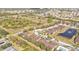 Aerial view showing home's location in a community with pool and pond at 4590 Turnberry Cir, North Port, FL 34288