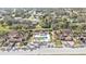 Community overview featuring homes, pool, and lush landscaping at 4590 Turnberry Cir, North Port, FL 34288