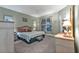 Main bedroom with plush carpet and backyard access at 4590 Turnberry Cir, North Port, FL 34288