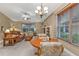 Bright dining area adjacent to living room and kitchen at 4590 Turnberry Cir, North Port, FL 34288