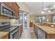 Spacious kitchen featuring granite countertops and island at 4590 Turnberry Cir, North Port, FL 34288