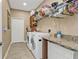Laundry room with washer, dryer, and built-in cabinets at 4590 Turnberry Cir, North Port, FL 34288