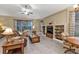 Living room features a built-in entertainment center and plush seating at 4590 Turnberry Cir, North Port, FL 34288