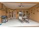 Outdoor patio area with seating, a grill, and access to the kitchen at 4590 Turnberry Cir, North Port, FL 34288