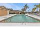 Relaxing community pool with lounge chairs and easy access at 4590 Turnberry Cir, North Port, FL 34288