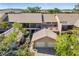 Two-story home with a two-car garage, screened-in porch, with landscaping and a view of the neighborhood at 5220 Landings Blvd # 104, Sarasota, FL 34231