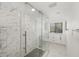 Bathroom featuring a glass shower, modern vanity, marble tile flooring, and natural light at 5220 Landings Blvd # 104, Sarasota, FL 34231