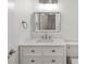 Bathroom featuring a vanity with white marble countertop, chrome fixtures, and a rectangular mirror at 5220 Landings Blvd # 104, Sarasota, FL 34231