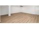 Bright and airy bedroom with hardwood floors, neutral walls, a ceiling fan, and a spacious closet at 5220 Landings Blvd # 104, Sarasota, FL 34231