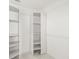 Walk-in closet featuring built-in shelving for optimal organization and storage space at 5220 Landings Blvd # 104, Sarasota, FL 34231