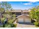 Charming two-story home with a two-car garage and a screened-in porch, complemented by lush landscaping at 5220 Landings Blvd # 104, Sarasota, FL 34231