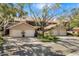 Street view of homes featuring two-car garages and brick paved driveways at 5220 Landings Blvd # 104, Sarasota, FL 34231