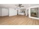 Spacious living room boasting an open floor plan, with hardwood flooring and plenty of natural light at 5220 Landings Blvd # 104, Sarasota, FL 34231