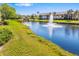 Scenic pond view with fountain and lush landscaping at this charming condo community at 5220 Landings Blvd # 104, Sarasota, FL 34231