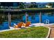 Relaxing dock area with two chairs and canal access at 529 Belvedere Ct, Punta Gorda, FL 33950