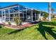 Screened pool area adjacent to the canal at 529 Belvedere Ct, Punta Gorda, FL 33950