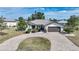 Single-story home with circular driveway at 543 Spring Lake Nw Blvd, Port Charlotte, FL 33952