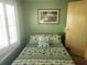 Guest bedroom with a full-size bed and window shutters at 6501 Center Ln, North Port, FL 34287