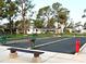 Community bocce ball courts with benches and trees at 6501 Center Ln, North Port, FL 34287