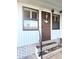 Front entrance of manufactured home with nautical decor at 6501 Center Ln, North Port, FL 34287
