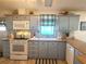 Bright kitchen with updated cabinets and countertops at 6501 Center Ln, North Port, FL 34287