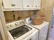 Laundry room with washer, dryer, and storage at 6501 Center Ln, North Port, FL 34287
