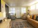 Living room with comfy seating and coastal decor at 6501 Center Ln, North Port, FL 34287